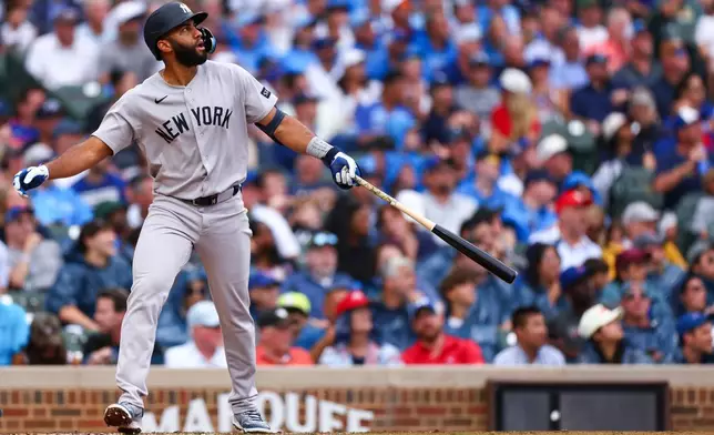 New York Yankees' Amed Rosario watches his home run during the fourth inning of a baseball game against the Chicago Cubs in Chicago, Friday, July 31, 2026. (AP Photo/Jessie Alcheh)