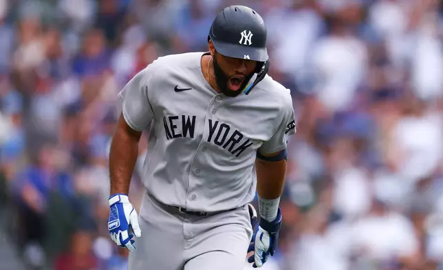 New York Yankees' Amed Rosario reacts after hitting a home run during the fourth inning of a baseball game against the Chicago Cubs in Chicago, Friday, July 31, 2026. (AP Photo/Jessie Alcheh)