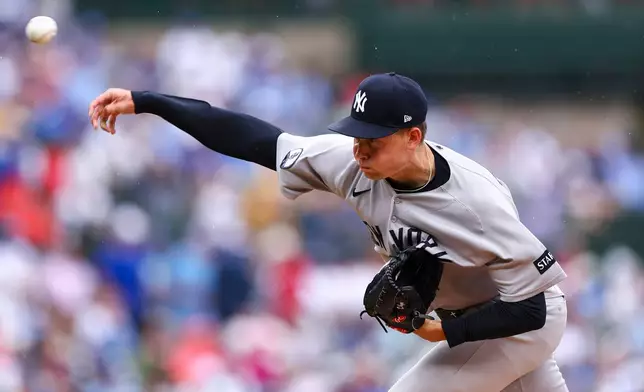 New York Yankees pitcher Will Warren throws to a Chicago Cubs batter during the first inning of a baseball game in Chicago, Friday, July 31, 2026. (AP Photo/Jessie Alcheh)