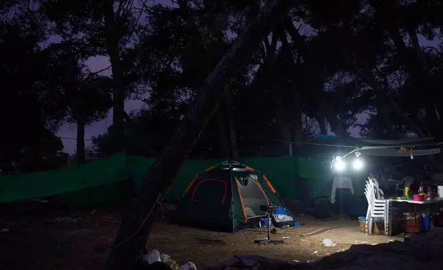 Tents of Christian pilgrims who spent overnight in the forest next to the Basilica of the Transfiguration on Mount Tabor, northern Israel, on Aug. 6, 2026. (AP Photo/Ariel Schalit)