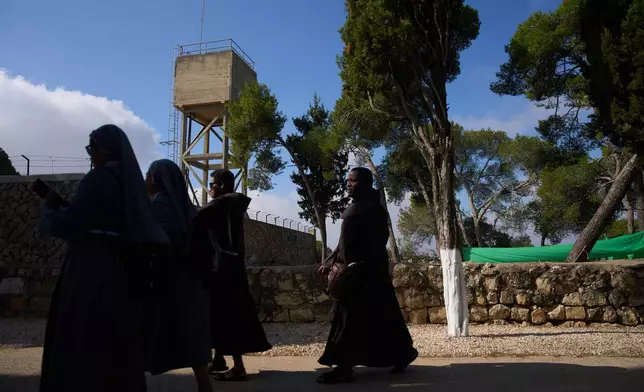 Priests and nuns make their way to the Basilica of the Transfiguration on Mount Tabor, northern Israel, on Aug. 6, 2026. (AP Photo/Ariel Schalit)