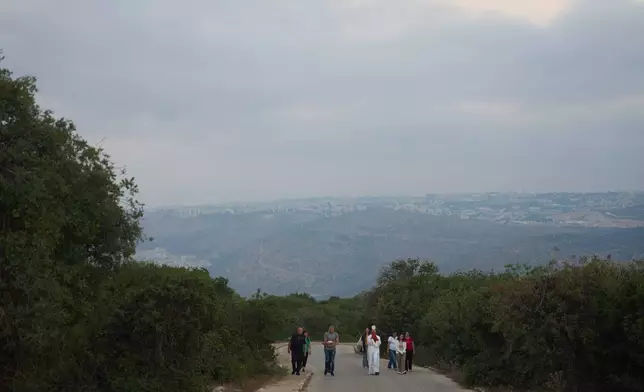 Rev. Fadi Shallufi leads Catholic pilgrims on a Eucharistic procession climbing to the Basilica of the Transfiguration on Mount Tabor, northern Israel, on Aug. 6, 2026. (AP Photo/Ariel Schalit)