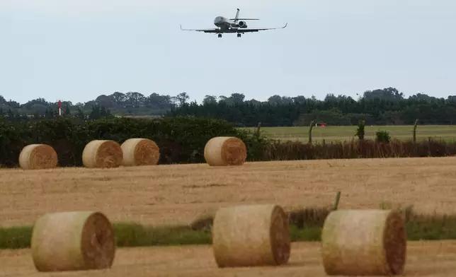 An Irish government plane believed to be carrying Daniel Kinahan landing at Casement Aerodrome in Baldonnell, Ireland, Sunday, Aug. 9, 2026, following him being extradited from Dubai, to face a charge of directing an organized crime group. (Brian Lawless/PA via AP)