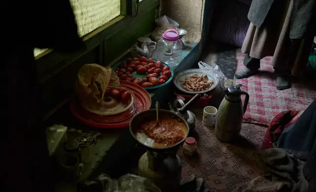 Food, bedding and items collected from the streets fill Sima's room at her home in Kabul, Afghanistan, Tuesday, Dec. 3, 2024. (AP Photo/Nava Jamshidi)
