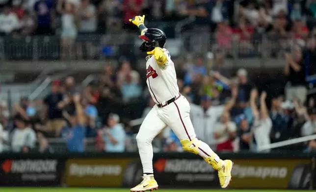Atlanta Braves' Ronald Acuña Jr. (13) celebrates after hitting a two-run homer against the Miami Marlins in the third inning of a baseball game, Thursday, Aug. 6, 2026, in Atlanta. (AP Photo/Mike Stewart)