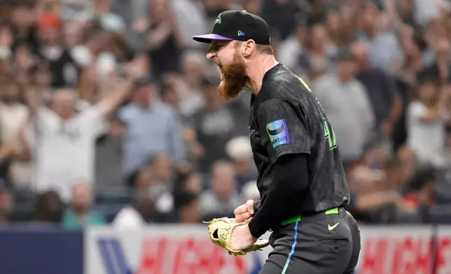 Tampa Bay Rays pitcher Bryan Baker celebrates after striking out Chicago White Sox's Randal Grichuk, not pictured, during the ninth inning to end a baseball game Saturday, Aug. 1, 2026, in St. Petersburg, Fla. (AP Photo/Jason Behnken)