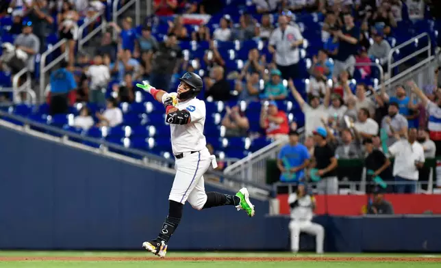 Miami Marlins' Heriberto Hernández rounds the bases after hitting a home run during the second inning of a baseball game against the Washington Nationals, Saturday, Aug. 22, 2026, in Miami. (AP Photo/Michael Laughlin)
