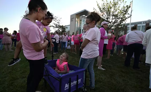 From left, Mandie Reibold, and Michelle Martinez, both of York, Pa., and their children, gather at a demonstration of fellow supporters of Lindsay Clancy outside Plymouth Superior Court, where Clancy is on trial in connection with the deaths of her three children, Thursday, Aug. 20, 2026, in Plymouth, Mass. (AP Photo/Josh Reynolds )