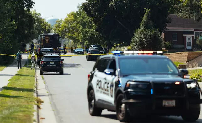Law enforcement respond to a call at a home daycare, Wednesday, Aug. 12, 2026, in Hopkins, Minn. (AP Photo/Carly Danek)