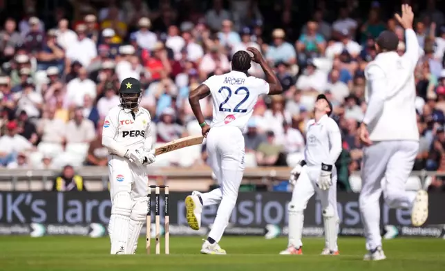 England's Jofra Archer, second left, celebrates taking the wicket of Pakistan's Imam-ul-Haq on day three of the first Test match between England and Pakistan in Leeds, England, Friday Aug. 21, 2026. (Mike Egerton/PA via AP)