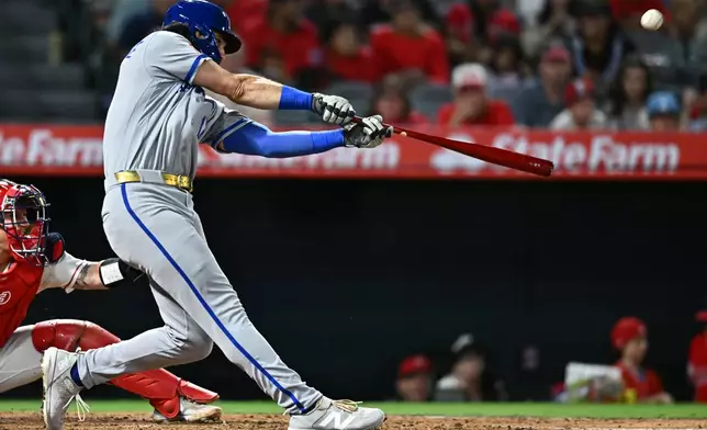 Kansas City Royals' Jac Caglianone hits a two-run home run during the fifth inning of a baseball game against the Los Angeles Angels, Friday, Aug. 14, 2026, in Anaheim, Calif. (AP Photo/William Liang)