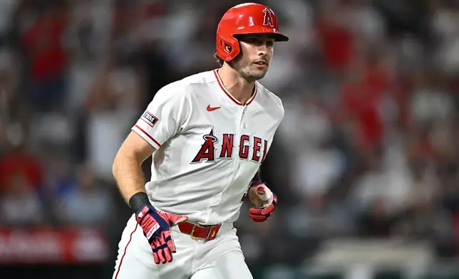 Los Angeles Angels' Josh Lowe runs after hitting a home run during the sixth inning of a baseball game against the Kansas City Royals, Friday, Aug. 14, 2026, in Anaheim, Calif. (AP Photo/William Liang)