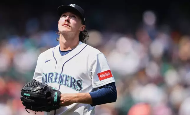Seattle Mariners starting pitcher Bryce Miller walks back to the dugout after the third inning of a baseball game against the Detroit Tigers, Thursday, Aug. 6, 2026, in Seattle. (AP Photo/Lindsey Wasson)