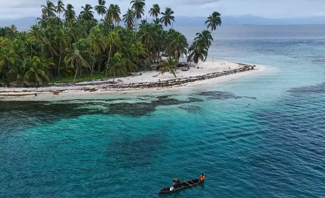 Locals fish in the Dutch Cays of Guna Yala on the Caribbean coast of Panama, Monday, Aug. 24, 2026. (AP Photo/Matias Delacroix)