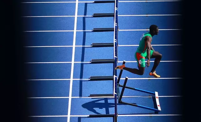 Edson Gomes of Portugal knocks down a hurdle during a men's 110 meters hurdles heat at the European Athletics Championships in Birmingham, England, Tuesday, Aug. 11, 2026. (AP Photo/Morgan Harlow)