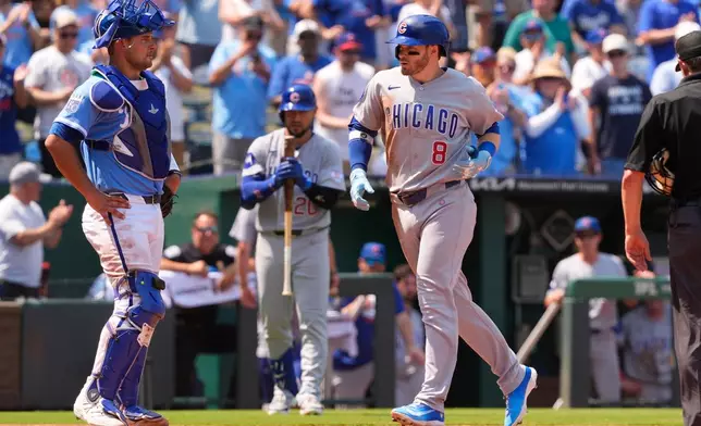 Chicago Cubs' Ian Happ crosses the plate after hitting a two-run home run during the sixth inning of a baseball game against the Kansas City Royals, Sunday, Aug. 9, 2026, in Kansas City, Mo. (AP Photo/Charlie Riedel)