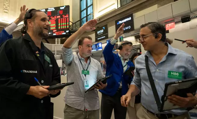Options traders Chris Dattolo, Scott Frinzi, Justin Kanda, and Ravi Bhandari, left to right, work on the floor of the New York Stock Exchange, Monday, Aug. 17, 2026, in New York. (AP Photo/Yuki Iwamura)