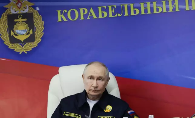 Russian President Vladimir Putin attends a meeting with navy officers on board of the Varyag missile cruiser of the Pacific Fleet during a military exercise near Yuzhno-Sakhalinsk, on Sakhalin Island, Russia, Wednesday, Aug. 12, 2026. (Gavriil Grigorov, Sputnik, Kremlin Pool Photo via AP)