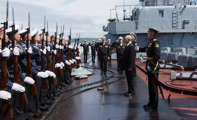 Russian President Vladimir Putin, second right, visits the Varyag missile cruiser of the Pacific Fleet to watch a military exercise near Yuzhno-Sakhalinsk, on Sakhalin Island, Russia, Wednesday, Aug. 12, 2026. (Gavriil Grigorov, Sputnik, Kremlin Pool Photo via AP)