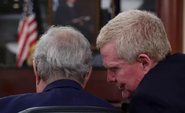 Alex Murdaugh speaks with his attorney, Dick Harpootlian, a status hearing on Friday, Aug. 14, 2026 at the Marc H. Westbrook Judicial Center in Lexington, S.C. (Tracy Glantz /The State via AP, Pool)