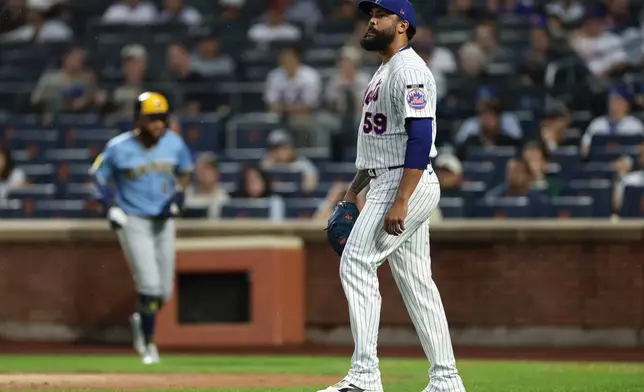New York Mets pitcher Sean Manaea reacts after Milwaukee Brewers' Jackson Chourio scored a run during the first inning of a baseball game Thursday, Aug. 27, 2026, in New York. (AP Photo/Adam Hunger)