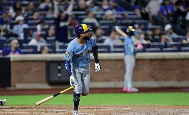 Milwaukee Brewers' Jackson Chourio watches his two-run home run during the eighth inning of a baseball game against the New York Mets, Thursday, Aug. 27, 2026, in New York. (AP Photo/Adam Hunger)
