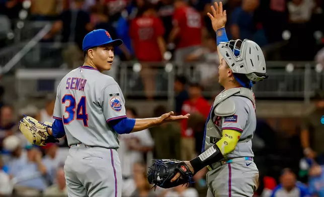New York Mets pitcher Kodai Senga, left, reacts with catcher Francisco Alvarez, right, after closing out the Atlanta Braves during the ninth inning of a baseball game, Monday, Aug. 10, 2026, in Atlanta. (AP Photo/Erik S. Lesser)