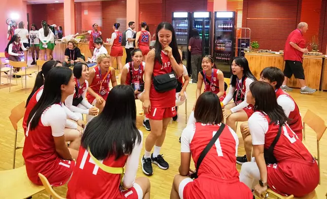 Japan's women's team have fun during the media day ahead of the Flag Football World Championships, the sports first Olympic qualifier for LA28, in Duesseldorf, Germany, Wednesday, Aug. 12, 2026. (AP Photo/Martin Meissner)
