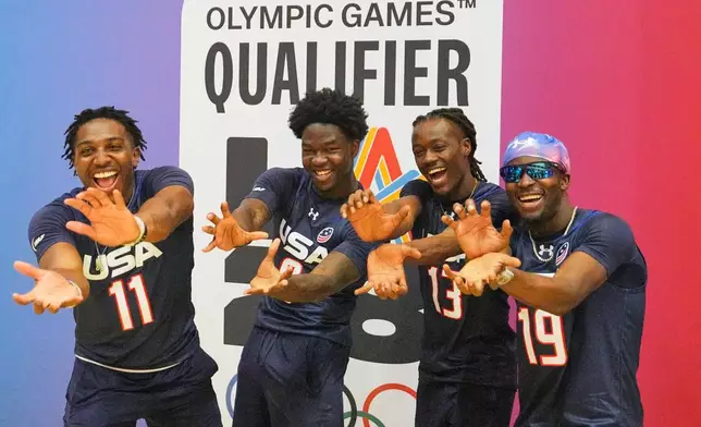 Isaiah Calhoun, Justin McMullen, Velton Brown and Shawn Theard of Team USA posing during the media day ahead of the Flag Football World Championships, the sports first Olympic qualifier for LA28, in Duesseldorf, Germany, Wednesday, Aug. 12, 2026. (AP Photo/Martin Meissner)