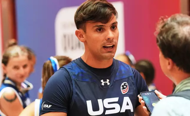United States quarterback Nicholas Casares speaks to the Associated Press during the media day ahead of the Flag Football World Championships, the sports first Olympic qualifier for LA28, in Duesseldorf, Germany, Wednesday, Aug. 12, 2026. (AP Photo/Martin Meissner)