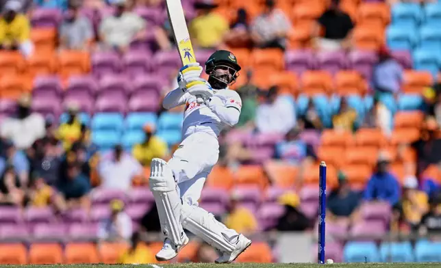 Mehidy Hasan Miraz of Bangladesh bats during play on day three of the first cricket test against Australia in Darwin, Australia, Saturday, Aug.15, 2026, (James Ross/AAPImage via AP)