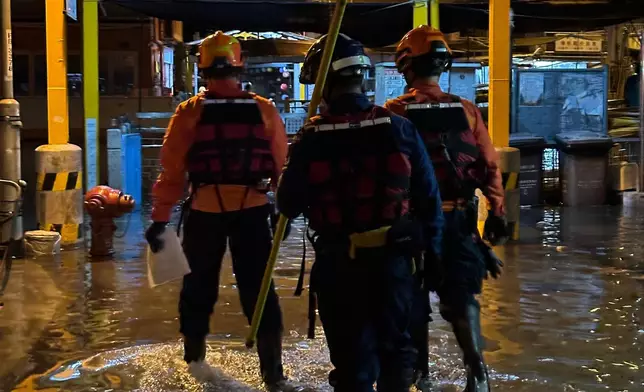 The Civil Aid Service (CAS) today (August 14) published its 2025 Annual Report. Photo shows CAS members patrolling in Tai O during a typhoon and advising passers-by to stay away from the shore. Source: HKSAR Government Press Releases
