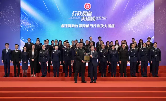 CE presents award certificates of Chief Executive's Award for Exemplary Performance to Inter-departmental Team for Wartime Bomb Disposal with Emergency Relief and Support Services and Inter-departmental Team for Light Public Housing Source: HKSAR Government Press Releases