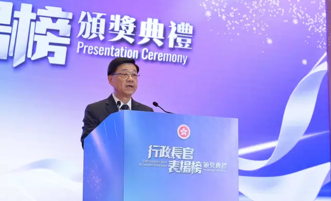 CE presents award certificates of Chief Executive's Award for Exemplary Performance to Inter-departmental Team for Wartime Bomb Disposal with Emergency Relief and Support Services and Inter-departmental Team for Light Public Housing Source: HKSAR Government Press Releases