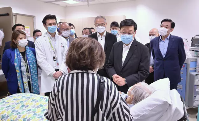 The Chief Executive, Mr John Lee (second right), earlier visited Kwong Wah Hospital to learn about the operation of its Ambulatory Orthopaedic Service Centre and to interact with a patient. Source: HKSAR Government Press Releases