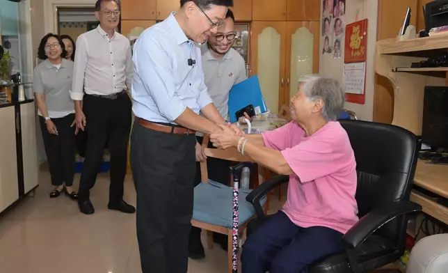 The Chief Executive, Mr John Lee, visited Sham Shui Po District today (August 26) to gather public views on Policy Address. Photo shows Mr Lee (centre), accompanied by the Secretary for Health, Professor Lo Chung-mau (second left), and the Secretary for Home and Youth Affairs, Miss Alice Mak (first left), visiting an elderly resident in Un Chau Estate to learn about her use of services from ambulatory care centres. Source: HKSAR Government Press Releases