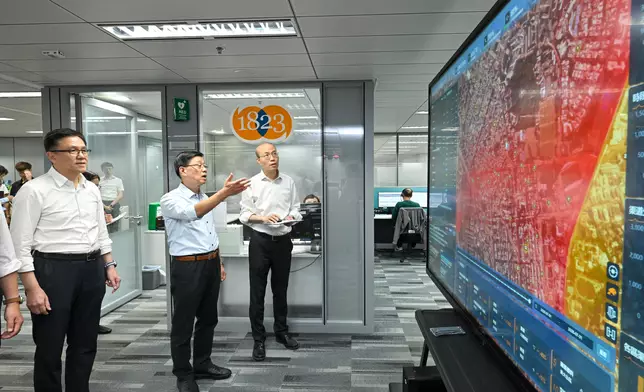 The Chief Executive, Mr John Lee, visited Sham Shui Po District today (August 26) to gather public views on Policy Address. Photo shows Mr Lee (centre), accompanied by the Secretary for Innovation, Technology and Industry, Professor Sun Dong (first left), visiting the 1823 Contact Centre to learn how the centre applies AI technologies to expedite the handling of public enquiries, requests for assistance and complaints. Source: HKSAR Government Press Releases