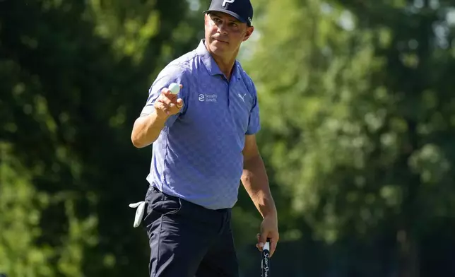 Gary Woodland reacts to hios putt on the 16th green during the second round of the BMW Championship golf tournament, Friday, Aug. 21, 2026, in St. Louis. (AP Photo/Jeff Roberson)