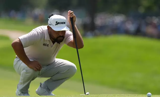 J.J. Spaun lines up his putt on the seventh green during the second round of the BMW Championship golf tournament, Friday, Aug. 21, 2026, in St. Louis. (AP Photo/Jeff Roberson)