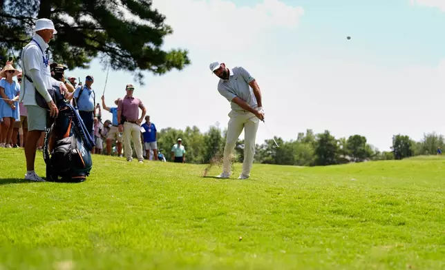 Scottie Scheffler chips onto the second green during the third round of the St. Jude Championship golf tournament Saturday, Aug. 15, 2026, in Memphis, Tenn. (AP Photo/George Walker IV)