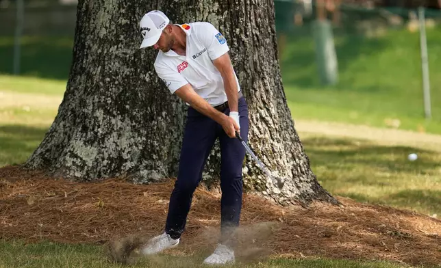 Sam Burns hits from the rough on the 17th hole during the third round of the St. Jude Championship golf tournament Saturday, Aug. 15, 2026, in Memphis, Tenn. (AP Photo/George Walker IV)