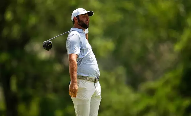 Scottie Scheffler watches his tee shot on the third hole during the third round of the St. Jude Championship golf tournament Saturday, Aug. 15, 2026, in Memphis, Tenn. (AP Photo/George Walker IV)