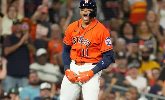 Houston Astros' Cam Smith celebrates after hitting a triple against the Texas Rangers during the fourth inning of a baseball game Friday, July 31, 2026, in Houston. (AP Photo/David J. Phillip)