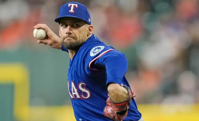 Texas Rangers starting pitcher Nathan Eovaldi throws against the Houston Astros during the first inning of a baseball game Friday, July 31, 2026, in Houston. (AP Photo/David J. Phillip)