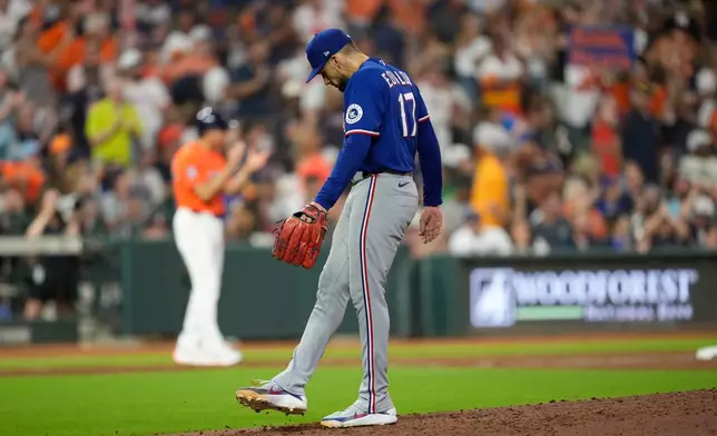 Texas Rangers starting pitcher Nathan Eovaldi reacts after giving up a home run to Houston Astros' Isaac Paredes during the fifth inning of a baseball game Friday, July 31, 2026, in Houston. (AP Photo/David J. Phillip)