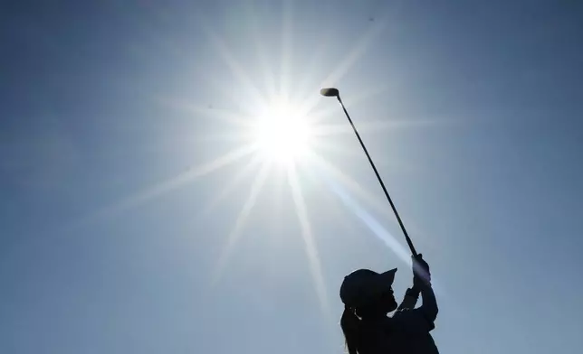 Shiho Kuwaki, of Japan, drives off the 16th tee during the third round of the Women's British Open golf championship in Lytham St Annes, England, Saturday, Aug. 1, 2026. (AP Photo/Jon Super)