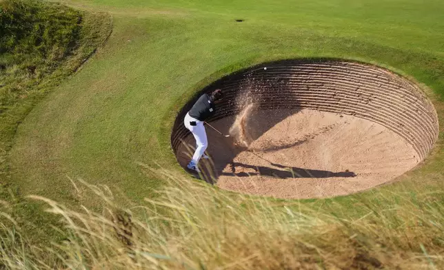 Miyu Yamashita, of Japan, plays a shot out of a bunker on the 3rd hole during the second round of the Women's British Open golf championship in Lytham St Annes, England, Friday, July 31, 2026. (AP Photo/Jon Super)