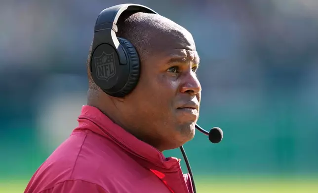 FILE - Washington Commanders offensive coordinator Eric Bieniemy watches from the sidelines during an NFL football game, Oct. 1, 2023, in Philadelphia. (AP Photo/Matt Rourke, File)
