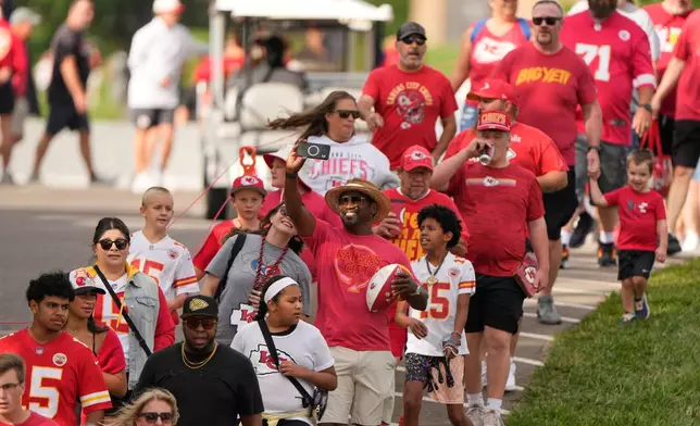 Fans arrive for the Kansas City Chiefs' NFL football training camp Saturday, Aug. 1, 2026, in St. Joseph, Mo. (AP Photo/Charlie Riedel)