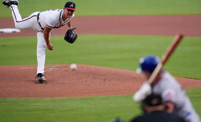 Atlanta Braves pitcher Tyler Mahle (54) delivers to New York Mets' A.J. Ewing in the first inning of a baseball game, Wednesday, Aug. 12, 2026, in Atlanta. (AP Photo/Mike Stewart)